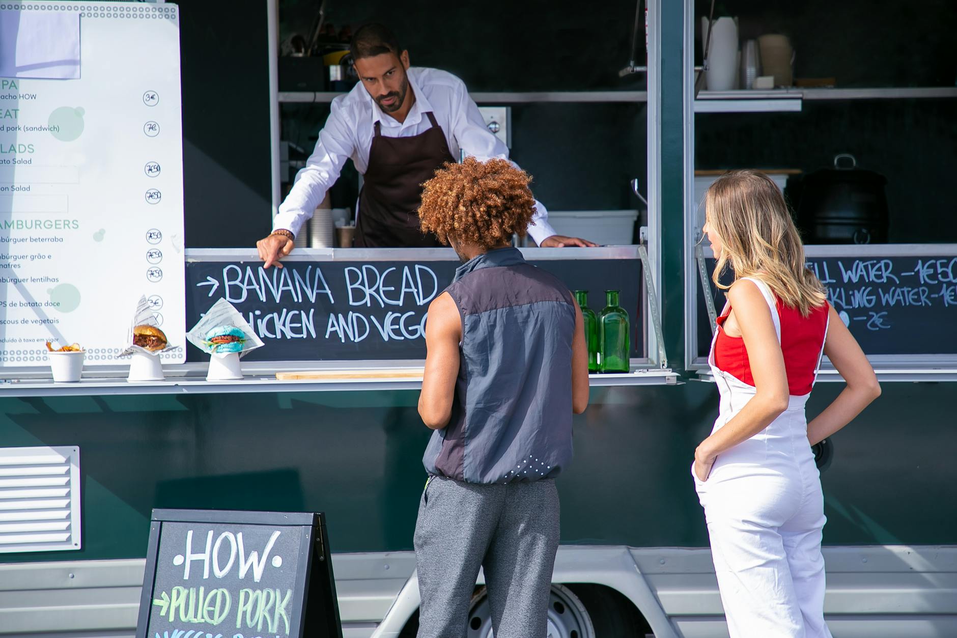 ethnic seller suggesting food to diverse clients